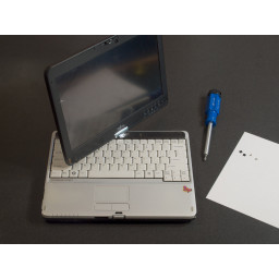 Шаг 2 Замена дисплея Fujitsu LifeBook T730 Удалите винты клавиатуры / рамки экрана